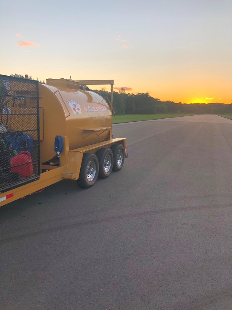 Sealcoating truck at sunset