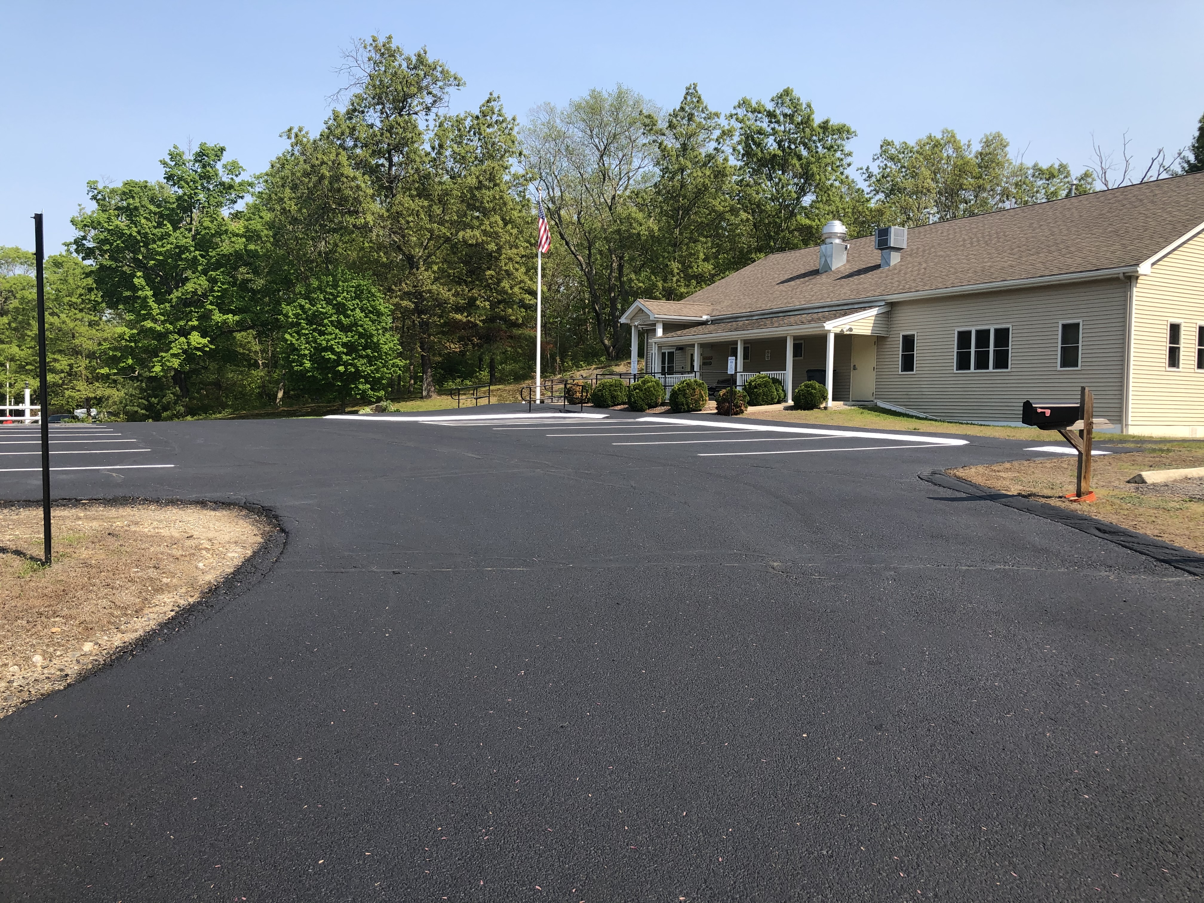 Freshly sealed commercial parking lot with crisp line striping